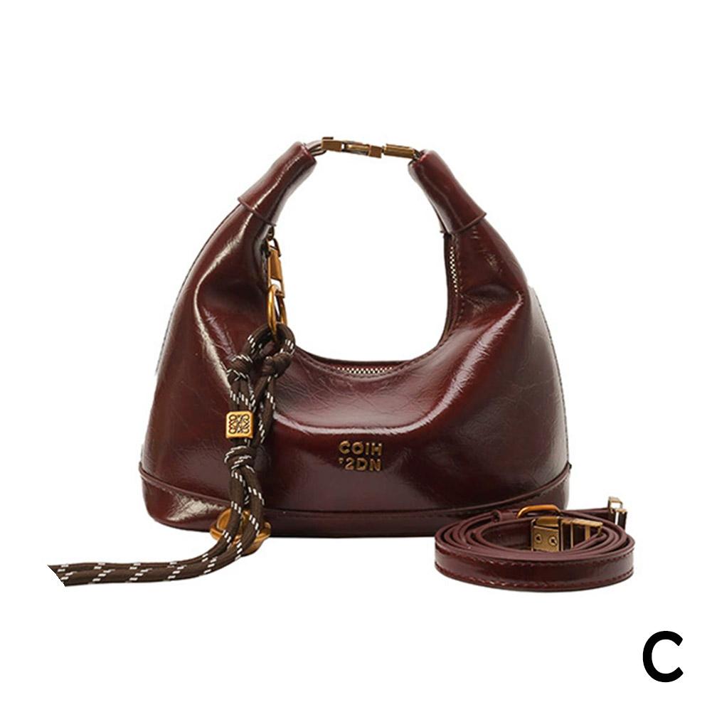 thumbnail image 1 of Bolso de mano estilo dumplings para mujer, versión coreana, tendencia primavera 2025, bolso de hombro plisado de alta calidad, versátil y de nicho., 1 of 2